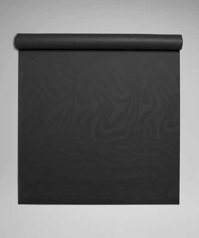 A rolled yoga mat ready for practice