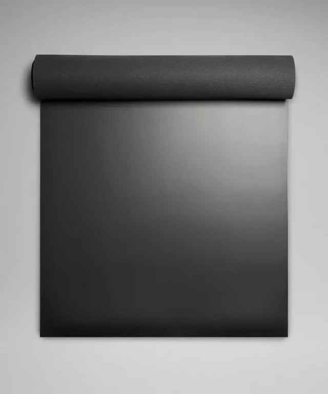 A rolled yoga mat ready for practice